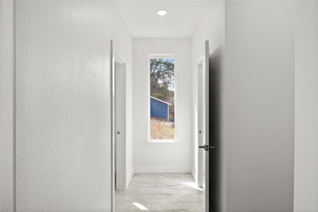 20714 Northland Dr, Lago Vista, TX 78645 - hallway featuring light marble finish flooring and recessed lighting