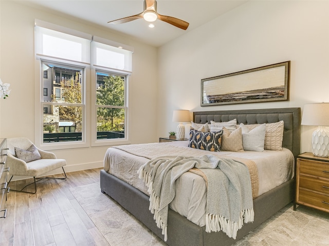 bedroom featuring hardwood / wood-style floors and ceiling fan