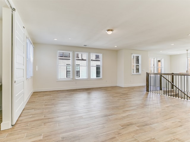 spare room featuring light hardwood / wood-style flooring