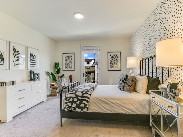 bedroom featuring access to outside and light carpet