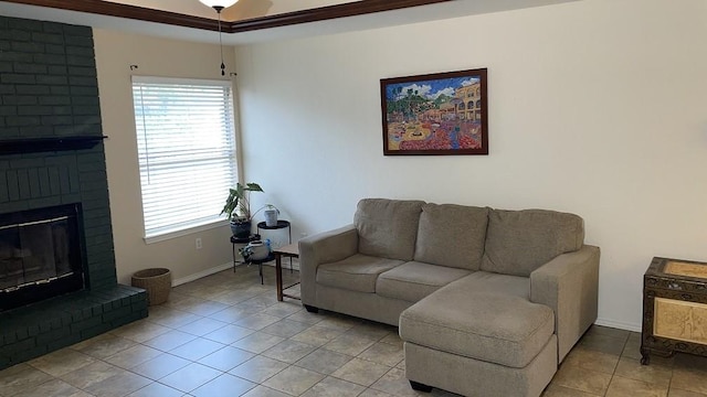 living room with a brick fireplace, plenty of natural light, and light tile patterned floors