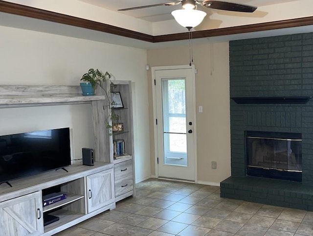 living room featuring light tile patterned flooring, a fireplace, and ceiling fan