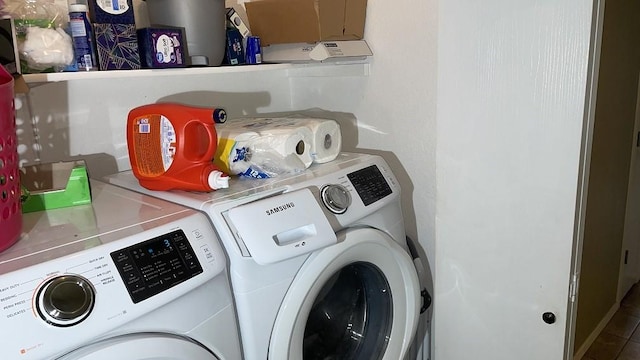 laundry room featuring washing machine and clothes dryer