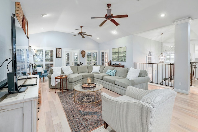 living room with high vaulted ceiling, ceiling fan, and light hardwood / wood-style floors