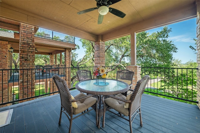 sunroom / solarium with wooden ceiling and ceiling fan