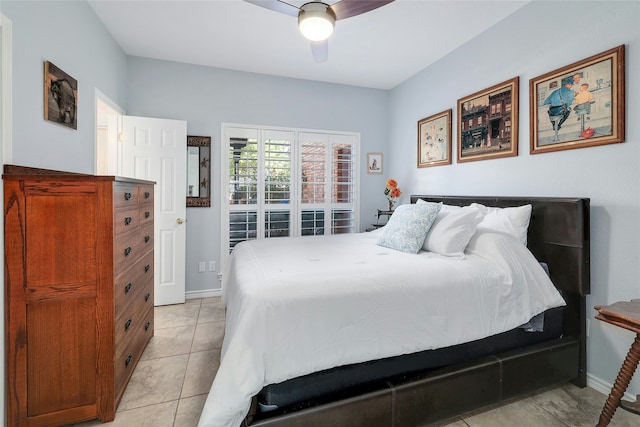 tiled bedroom featuring ceiling fan