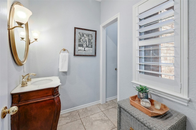 bathroom with tile patterned flooring and vanity