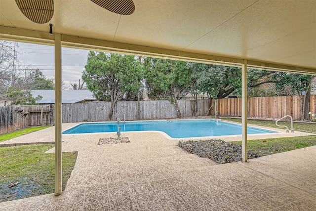 view of swimming pool with a patio area