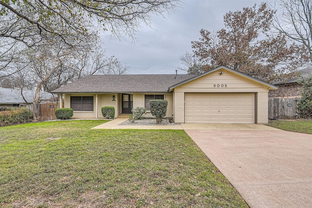 ranch-style home with a garage and a front yard