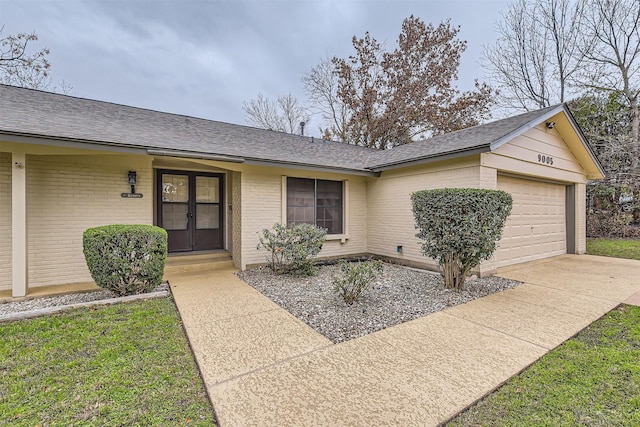 single story home with a garage