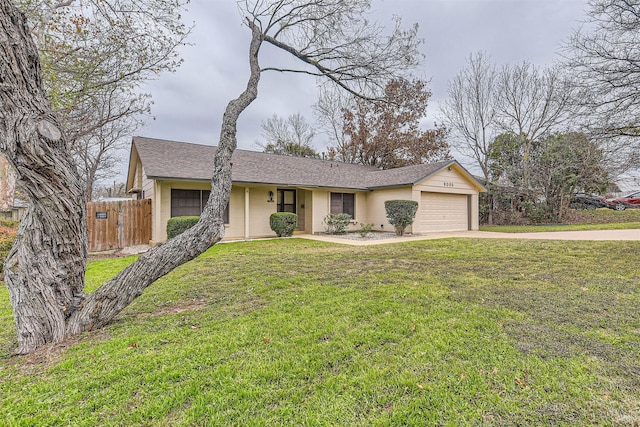 single story home with a front lawn and a garage