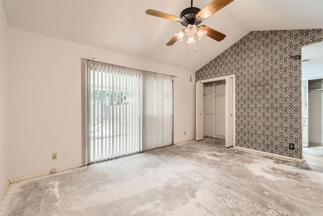 unfurnished bedroom with ceiling fan and vaulted ceiling