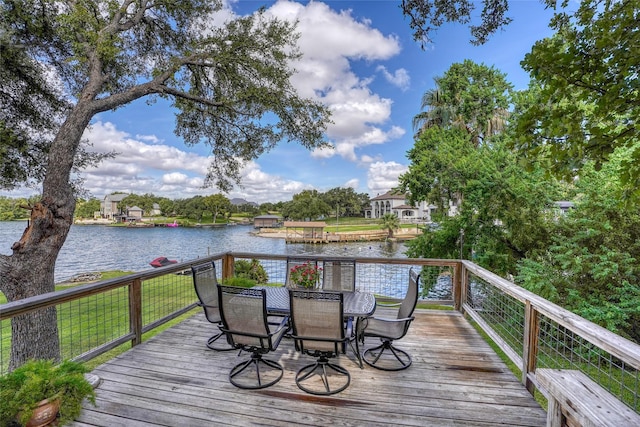 wooden terrace featuring a water view