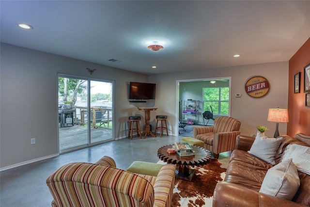 living room with concrete flooring