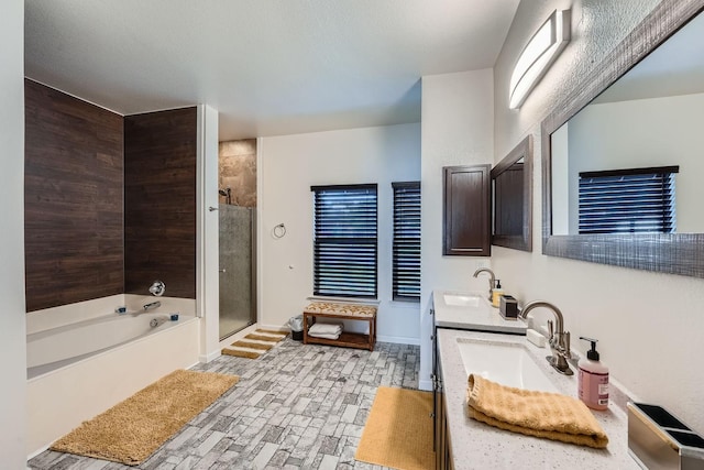 bathroom featuring separate shower and tub and vanity