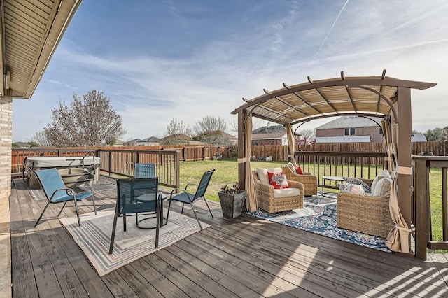 wooden deck featuring a hot tub, a pergola, a yard, and outdoor lounge area