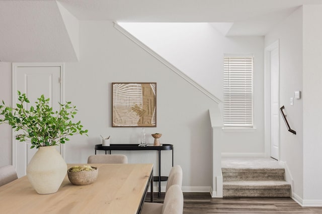 stairs featuring wood-type flooring