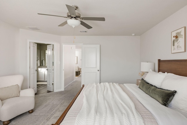 bedroom with ensuite bathroom and ceiling fan