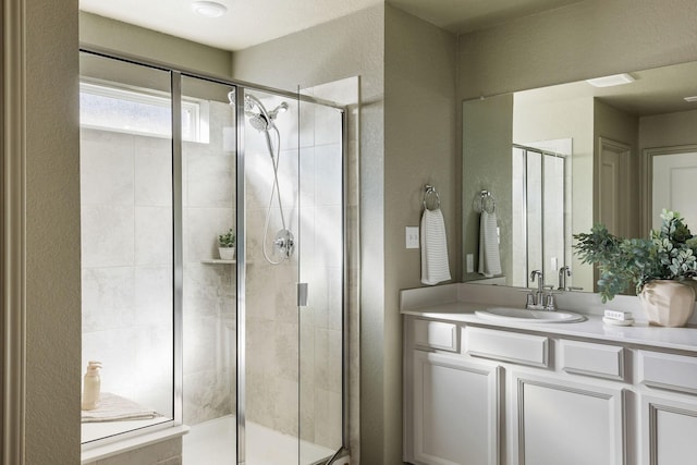 bathroom with vanity and walk in shower