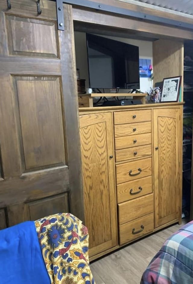 bedroom with light wood-type flooring