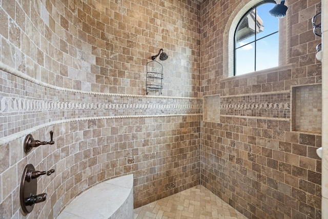 bathroom featuring a tile shower