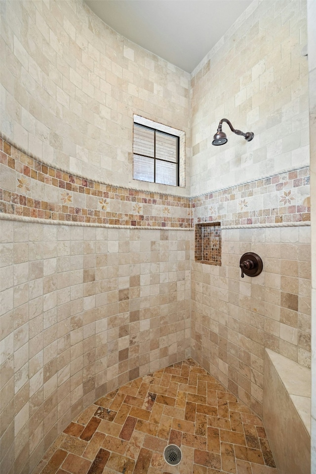 bathroom featuring tiled shower