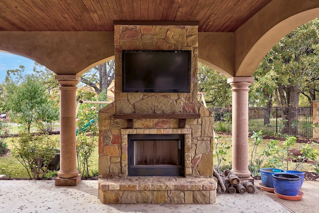 view of patio with an outdoor stone fireplace