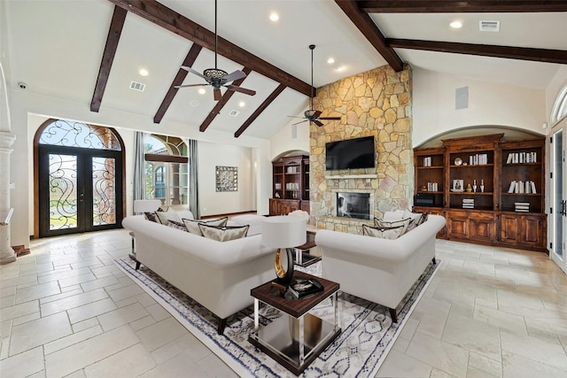 living room featuring french doors, high vaulted ceiling, beamed ceiling, and a fireplace