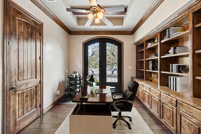 office featuring a raised ceiling, ornamental molding, ceiling fan, french doors, and dark hardwood / wood-style floors