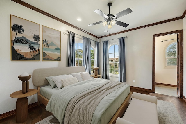 bedroom featuring ceiling fan, dark wood-type flooring, and crown molding