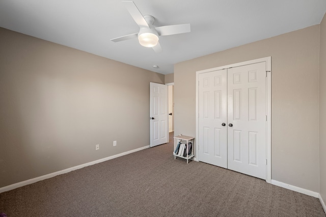 unfurnished bedroom featuring ceiling fan, a closet, and carpet floors