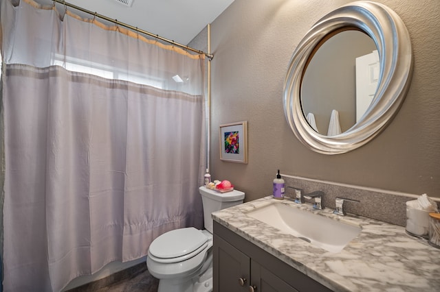 full bathroom with toilet, shower / bathtub combination with curtain, and vanity