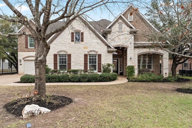 view of front of property featuring a front yard and a garage