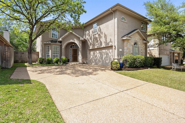 view of front of house with a front yard and a garage