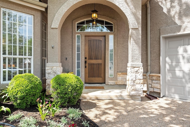 entrance to property featuring a garage