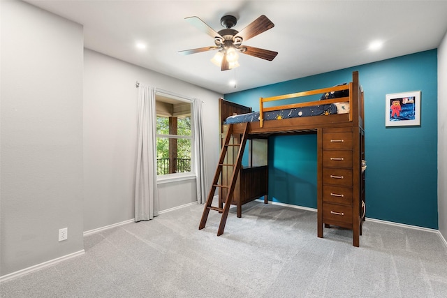 unfurnished bedroom with ceiling fan and light carpet