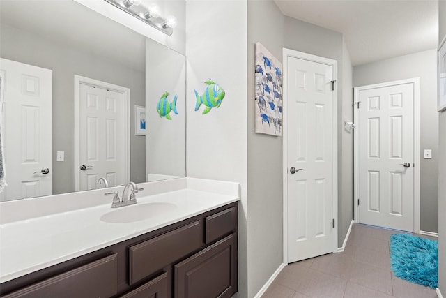 bathroom with tile patterned flooring and vanity