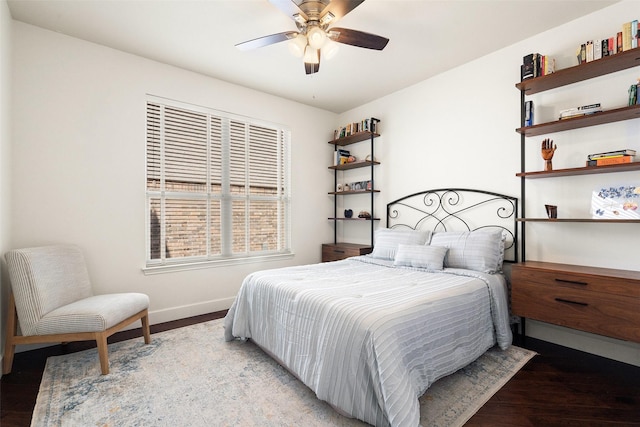 bedroom with ceiling fan and hardwood / wood-style floors