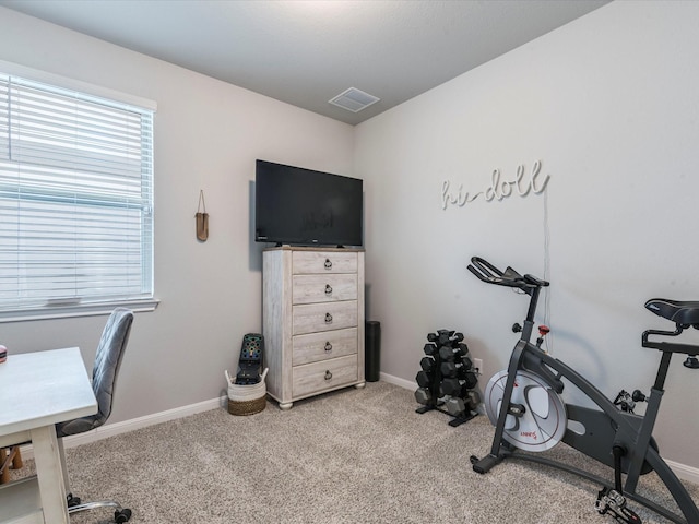 workout area with carpet, visible vents, and baseboards