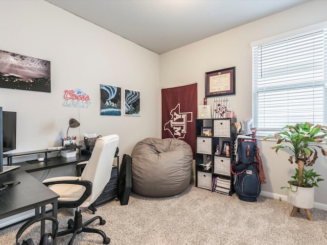 carpeted office featuring baseboards