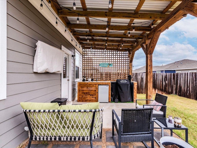 view of patio / terrace featuring fence and area for grilling