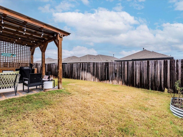 view of yard with a fenced backyard and a patio