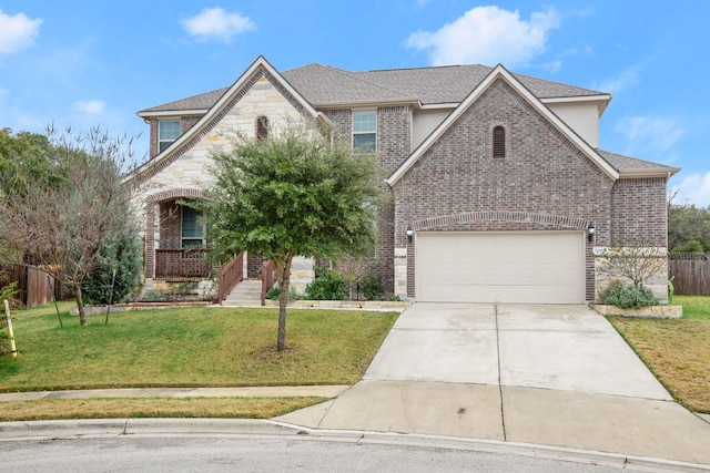 view of front of house with a garage and a front lawn