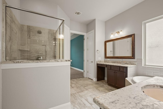 bathroom featuring independent shower and bath and vanity