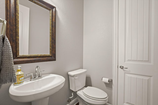 bathroom with sink and toilet