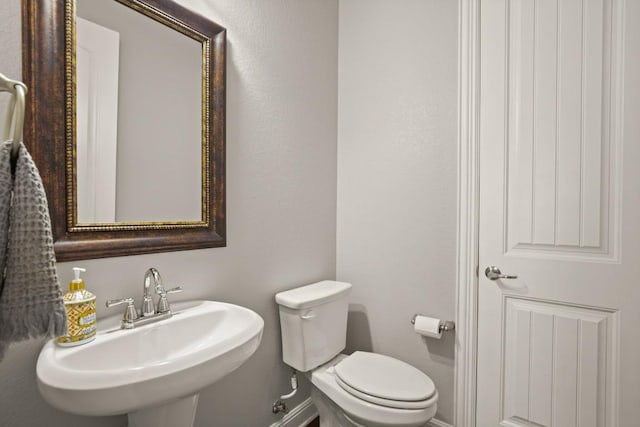 3816 Tango Ct, Leander, TX 78641 - half bath featuring a sink and toilet