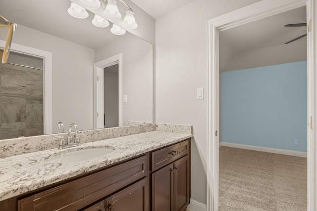 bathroom featuring ceiling fan and vanity