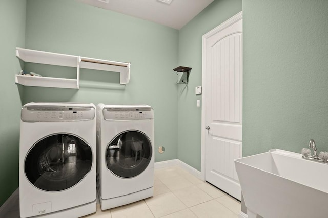 3816 Tango Ct, Leander, TX 78641 - washroom with washing machine and clothes dryer and tile patterned flooring