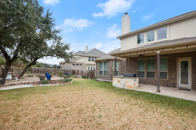 3816 Tango Ct, Leander, TX 78641 - fenced backyard with an outdoor kitchen, a patio, and ceiling fan