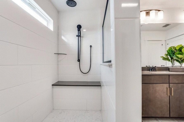 bathroom featuring vanity and walk in shower